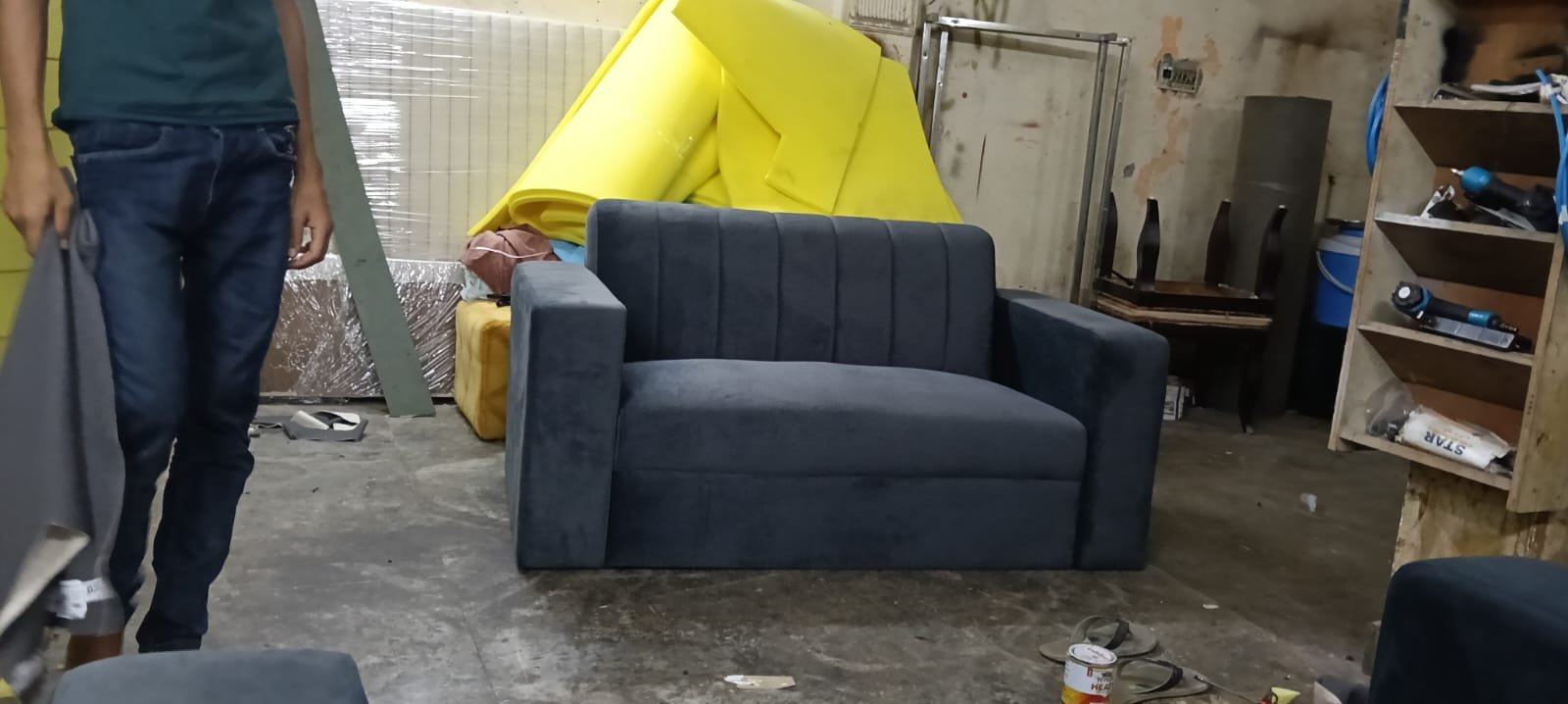 Grey channel tufted L-shaped sofa with piping finished in Ghaziabad