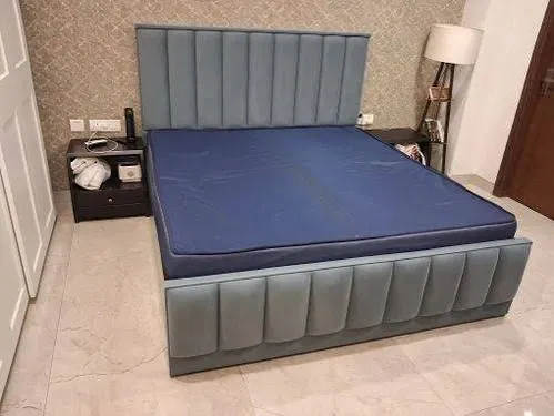 Blue-grey channel panel upholstered bed with tall headboard