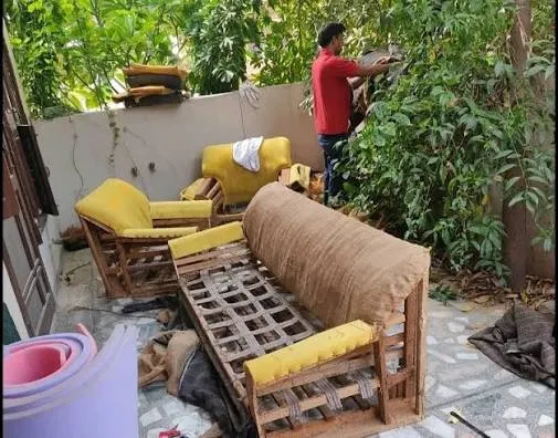 Sofa and chairs stripped down to the wooden frame before reupholstery